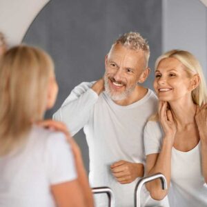 Mature Couple In Mirror | Northeast Medical Aesthetics | Beauty & Ant-Aging Services