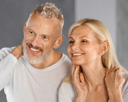 Mature Couple In Mirror | Northeast Medical Aesthetics | Beauty & Ant-Aging Services